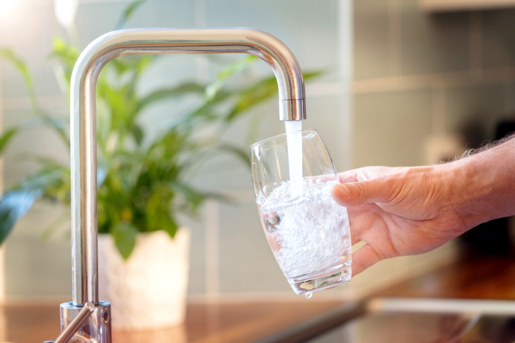 filling a glass with water from the tap